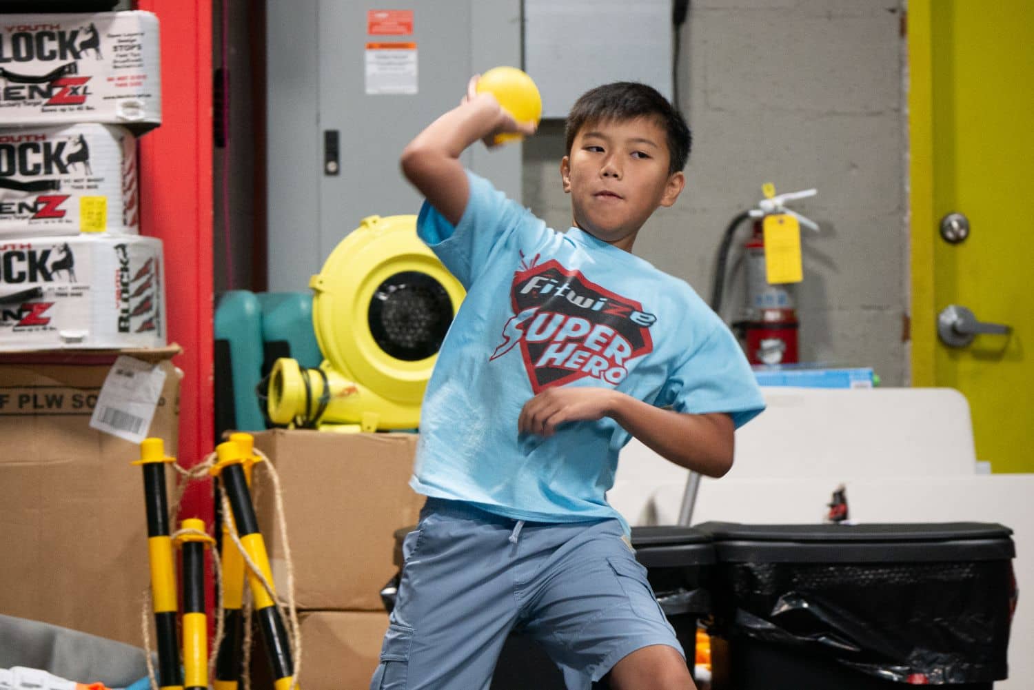 Asian boy playing sports after school