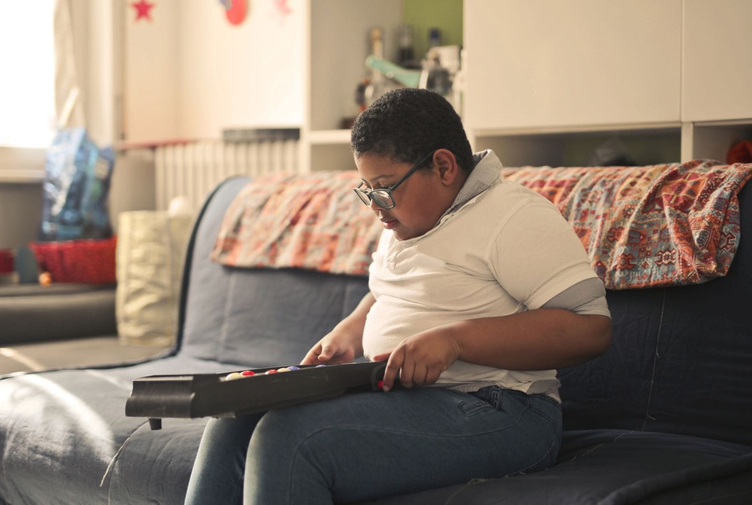 overweight boy playing a game