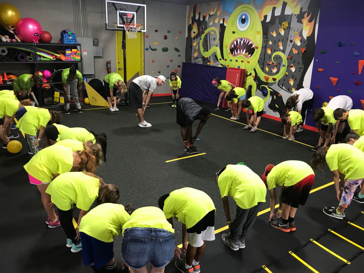 group of kids with a fitness instructor